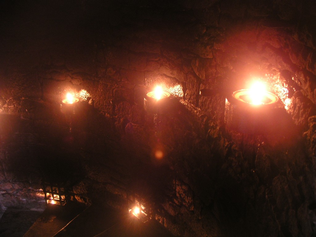Oil lamps on the stairway in the castle at Beynac